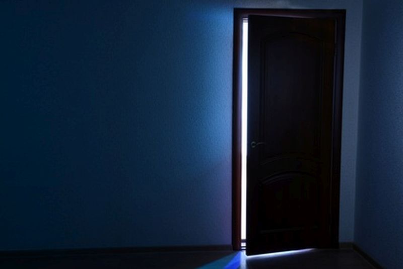 Open door with bright light outside